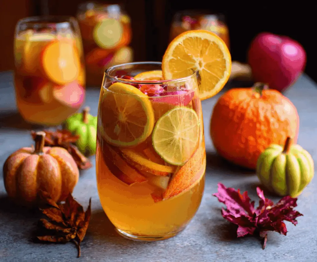 Refreshing Apple Cider Sangria with Fresh Fall Fruits in a glass pitcher, perfect for autumn gatherings