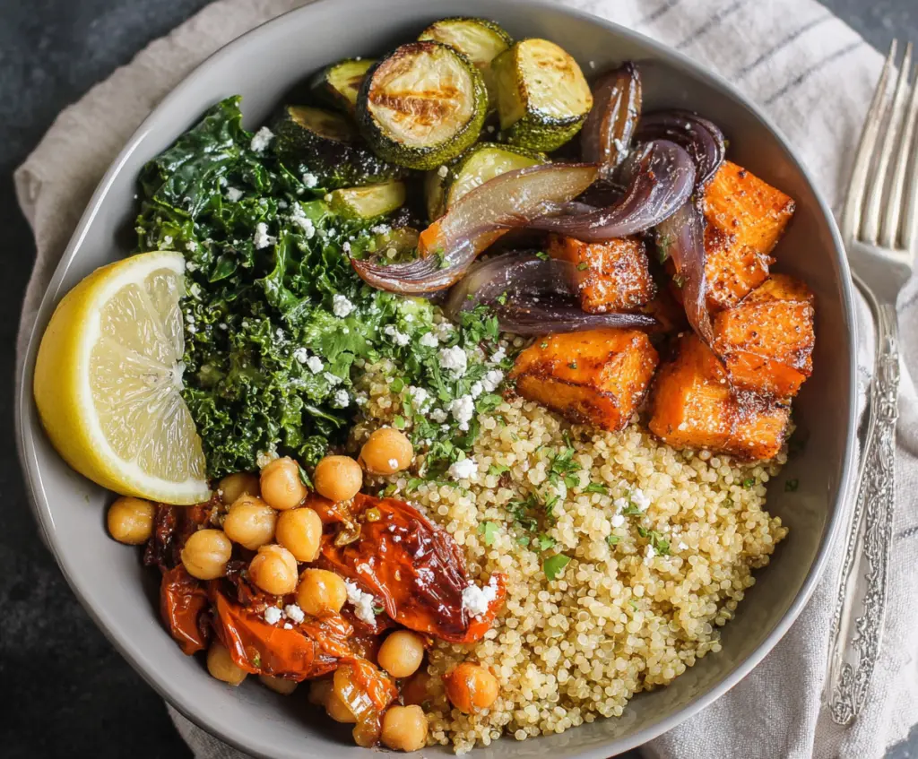 Colorful clean eating quinoa veggie bowl with fresh vegetables and herbs.